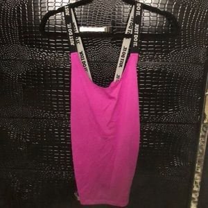 Nike women’s racerback tank top. Mesh detailing on the sides at underarms.